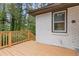 The wooden deck on this home has wooden railings and white brick siding at 2148 Meador Se Ave, Atlanta, GA 30315