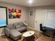 Bright living room with a comfortable couch, colorful rug, and a large window for natural light at 2148 Meador Se Ave, Atlanta, GA 30315