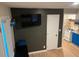 Modern living space with TV, adjacent kitchen, and stylish décor including blue accents at 2148 Meador Se Ave, Atlanta, GA 30315