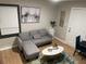 Inviting living room with a gray couch, decorative coffee table, and natural light at 2148 Meador Se Ave, Atlanta, GA 30315