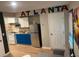 Open-concept living space with a modern kitchen and stylish décor featuring a silver refrigerator at 2148 Meador Se Ave, Atlanta, GA 30315