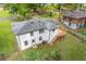 Back of house features a deck and outdoor access, all on a well maintained lawn at 2148 Meador Se Ave, Atlanta, GA 30315
