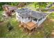 Back of house features a deck and outdoor access, all on a well maintained lawn at 2148 Meador Se Ave, Atlanta, GA 30315
