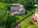 Aerial view of a gray two-story home with a large, fenced backyard and mature trees, providing ample privacy at 3171 Davis Rd, Marietta, GA 30062