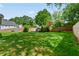 Backyard with beautiful lawn and fence, and well maintained landscaping at 3171 Davis Rd, Marietta, GA 30062