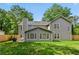 Backyard with beautiful lawn and fence, and partial view of home and patio area at 3171 Davis Rd, Marietta, GA 30062