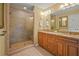 Bathroom featuring a glass-enclosed shower, double vanity, and granite counters at 3171 Davis Rd, Marietta, GA 30062