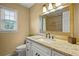Well-lit bathroom featuring granite countertops, modern fixtures, and a tiled shower/tub enclosure at 3171 Davis Rd, Marietta, GA 30062