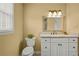A bright bathroom includes granite countertop vanity, tile shower/tub combo, and white ceramic toilet at 3171 Davis Rd, Marietta, GA 30062
