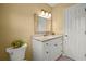 Bathroom showing a white granite vanity with updated fixtures, and a ceramic toilet at 3171 Davis Rd, Marietta, GA 30062