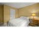 Cozy bedroom featuring a plush bed, nightstand with lamp, and neutral-toned walls at 3171 Davis Rd, Marietta, GA 30062