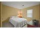 This bedroom is well lit with a large bed, side table, and a big window at 3171 Davis Rd, Marietta, GA 30062