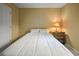 This sunny bedroom includes a comfortable bed, bedside table, and closet at 3171 Davis Rd, Marietta, GA 30062
