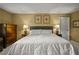 This primary bedroom features a comfortable bed and is filled with natural light at 3171 Davis Rd, Marietta, GA 30062