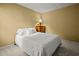 This bedroom offers carpet, a bed with white linens, and a wood dresser at 3171 Davis Rd, Marietta, GA 30062