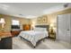 Bedroom showcases soft natural light, a bed with crisp linens, and dresser at 3171 Davis Rd, Marietta, GA 30062