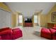 Bonus room features comfortable seating and two windows for natural light at 3171 Davis Rd, Marietta, GA 30062