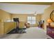 Comfortable exercise room with ceiling fan, windows, exercise bike, and desk space at 3171 Davis Rd, Marietta, GA 30062