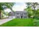 Charming two-story home with grey siding, dark shutters, manicured lawn and an attached two car garage at 3171 Davis Rd, Marietta, GA 30062
