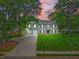 Charming two-story home featuring a manicured lawn, a spacious driveway, and a two-car garage at 3171 Davis Rd, Marietta, GA 30062