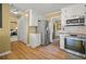 Bright kitchen with stainless steel appliances, granite countertops, and hardwood flooring at 3171 Davis Rd, Marietta, GA 30062