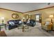 Comfortable living room with leather sofas, neutral carpet, and ample seating at 3171 Davis Rd, Marietta, GA 30062