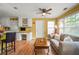 Living room featuring open concept to desk area, natural light, and light-colored walls at 3171 Davis Rd, Marietta, GA 30062
