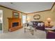 Cozy living room with brick fireplace, leather sofa, and neutral carpet at 3171 Davis Rd, Marietta, GA 30062