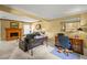 Spacious living room with fireplace, leather sofa, and office space at 3171 Davis Rd, Marietta, GA 30062