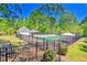 Fenced community pool offers a refreshing escape on warm days with sunbathing areas and shaded structures at 3171 Davis Rd, Marietta, GA 30062