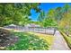 Enjoy community living with pool access surrounded by a fence and lush greenery on a bright, sunny day at 3171 Davis Rd, Marietta, GA 30062