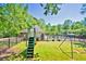 Enjoy the playground, pool, and picnic pavilion amenities on a bright day with mature trees and blue skies at 3171 Davis Rd, Marietta, GA 30062