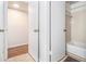 Bright bathroom featuring a tub/shower combination, white tile surround, and neutral flooring at 318 Tuxworth Cir, Decatur, GA 30033