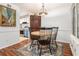 Bright dining room featuring hardwood floors, chandelier, and decorative rug at 318 Tuxworth Cir, Decatur, GA 30033
