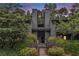 Attractive exterior of home featuring mature landscaping and a private entrance at 318 Tuxworth Cir, Decatur, GA 30033
