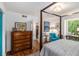 Spacious primary bedroom with four poster bed, chest and views at 318 Tuxworth Cir, Decatur, GA 30033