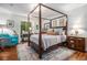 Bright main bedroom with hardwood floors and four-poster bed at 318 Tuxworth Cir, Decatur, GA 30033