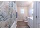 Bright bathroom with shower, vanity, and updated fixtures at 429 Orchard Dr, Stone Mountain, GA 30083