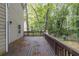 Spacious deck with railings overlooking lush greenery and backyard; great for outdoor entertaining at 429 Orchard Dr, Stone Mountain, GA 30083