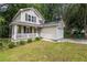 Charming two-story home with a covered front porch and an attached one car garage at 429 Orchard Dr, Stone Mountain, GA 30083