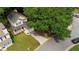 Inviting two-story home with mature shade trees, an attached garage and convenient street access enhancing the property's setting at 429 Orchard Dr, Stone Mountain, GA 30083