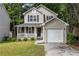 Charming two-story home with a covered front porch and a one car attached garage at 429 Orchard Dr, Stone Mountain, GA 30083