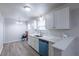 Bright kitchen with stainless steel appliances, white cabinets, and quartz countertops at 429 Orchard Dr, Stone Mountain, GA 30083