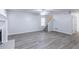 Spacious living room featuring new laminate flooring, a fireplace, and neutral paint at 429 Orchard Dr, Stone Mountain, GA 30083