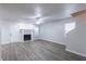 Spacious living room featuring new laminate flooring, a fireplace, and neutral paint at 429 Orchard Dr, Stone Mountain, GA 30083