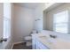 Bright powder room with white vanity, new fixtures, and natural light from the window at 429 Orchard Dr, Stone Mountain, GA 30083