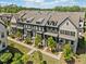 Aerial view of a modern townhome community highlighting architectural design, landscaping, and community layout at 964 Catamaran Ct, Alpharetta, GA 30005