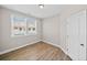 Bedroom with laminate flooring that offers natural light and closet space at 964 Catamaran Ct, Alpharetta, GA 30005