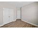 An extra bedroom with laminate floors and two closets at 964 Catamaran Ct, Alpharetta, GA 30005