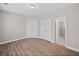 Spacious bedroom featuring hardwood floors, ample closet space, and an en-suite bathroom with a glass-enclosed shower at 964 Catamaran Ct, Alpharetta, GA 30005